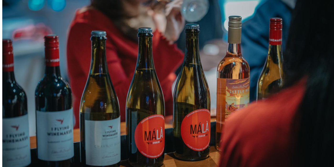 Málà Party Night in Cru with guests wearing red, enjoying sparkling wine with spicy Sichuan food