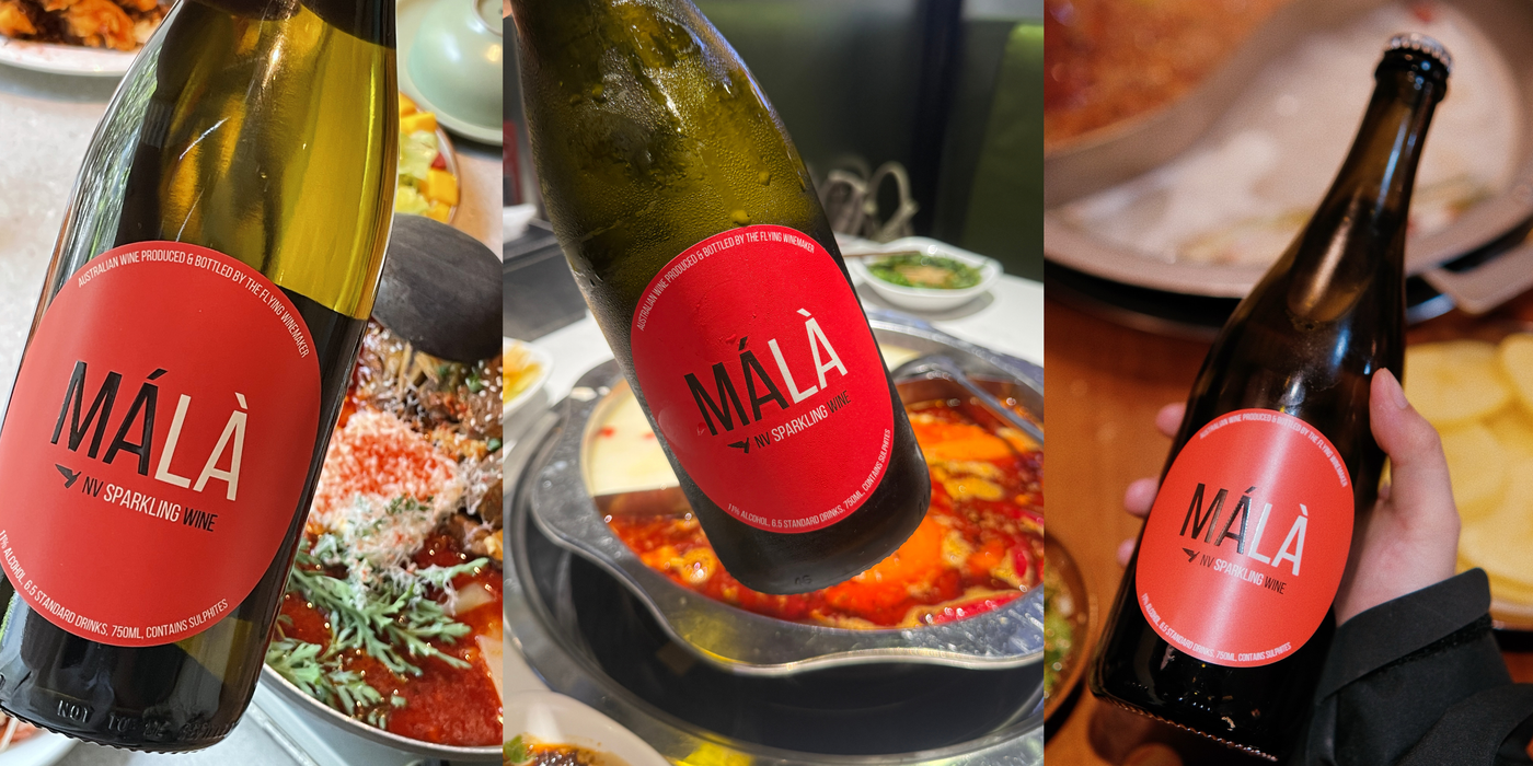 MALÀ sparkling grape-based beverage served in small tasting glasses at a Sichuan hot pot restaurant table